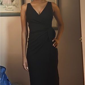 H&M sleek form fitting black dress. Side knot detail. Size XS
